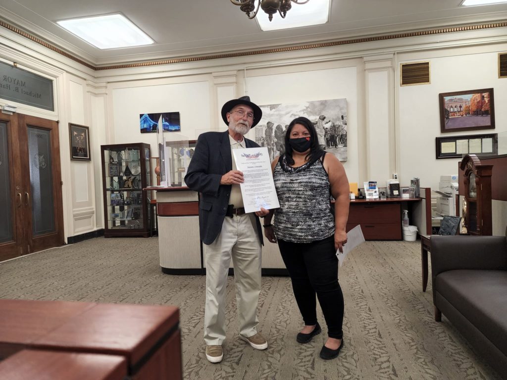 Jim Martin presents a Proclamation to the staff at the mayor's office in beautiful downtown Denver, Colorado