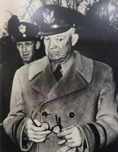 This photograph by Striper Red Grandy captured the facial expression of General Eisenhower as he received the news of President Trumans decision to relieve General MacArthur of his command