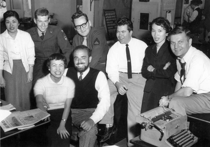 The photo was taken when Shel Silverstein revisited the Tokyo Office in 1959 Toshi Cooper is seated in the front with him