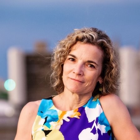 Kathy Kiely, Lee Hills Chair in Free Press Studies, smiling in a professional headshot.